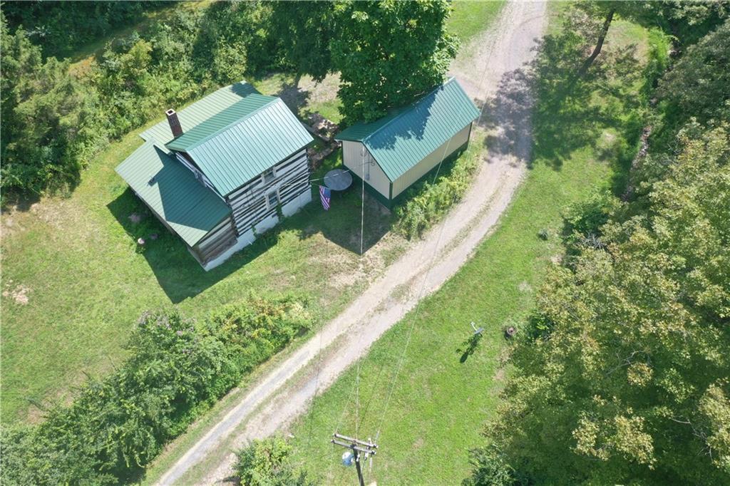 457 Grasser Road Manns Choice, PA 15550 - Photo 8 of 36 a view of a house with a yard