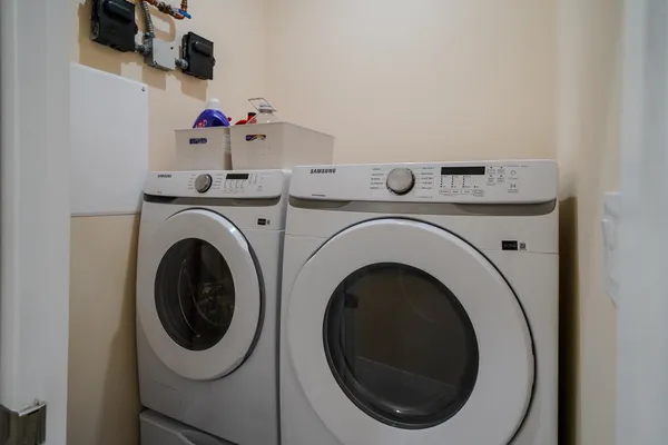 a utility room with dryer and washer
