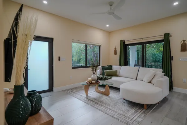 a living room with furniture and a flat screen tv
