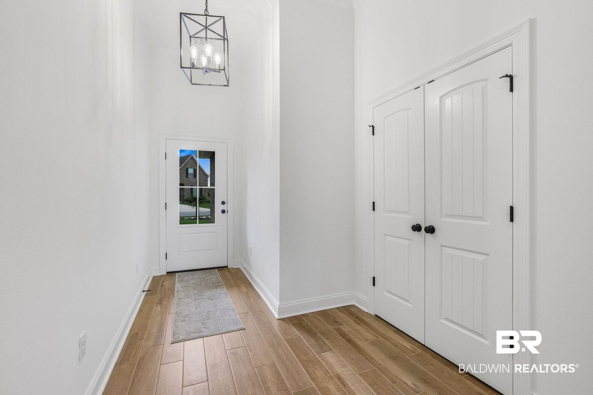 9855 Chipper Lane Foley, AL 36535 - Photo 29 of 48 Interior space with light wood-type flooring and a notable chandelier