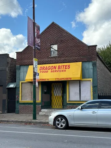 a front view of a building with parking space