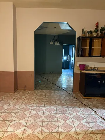 a view of a living room and a car garage