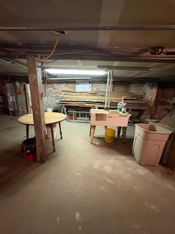 a storage room with furniture and a window