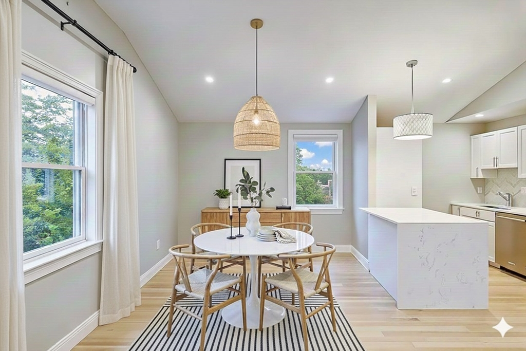 29 Goldsmith Street, Unit 3 Boston, MA 02130 - Photo 2 of 21 a view of a dining room with furniture window and wooden floor