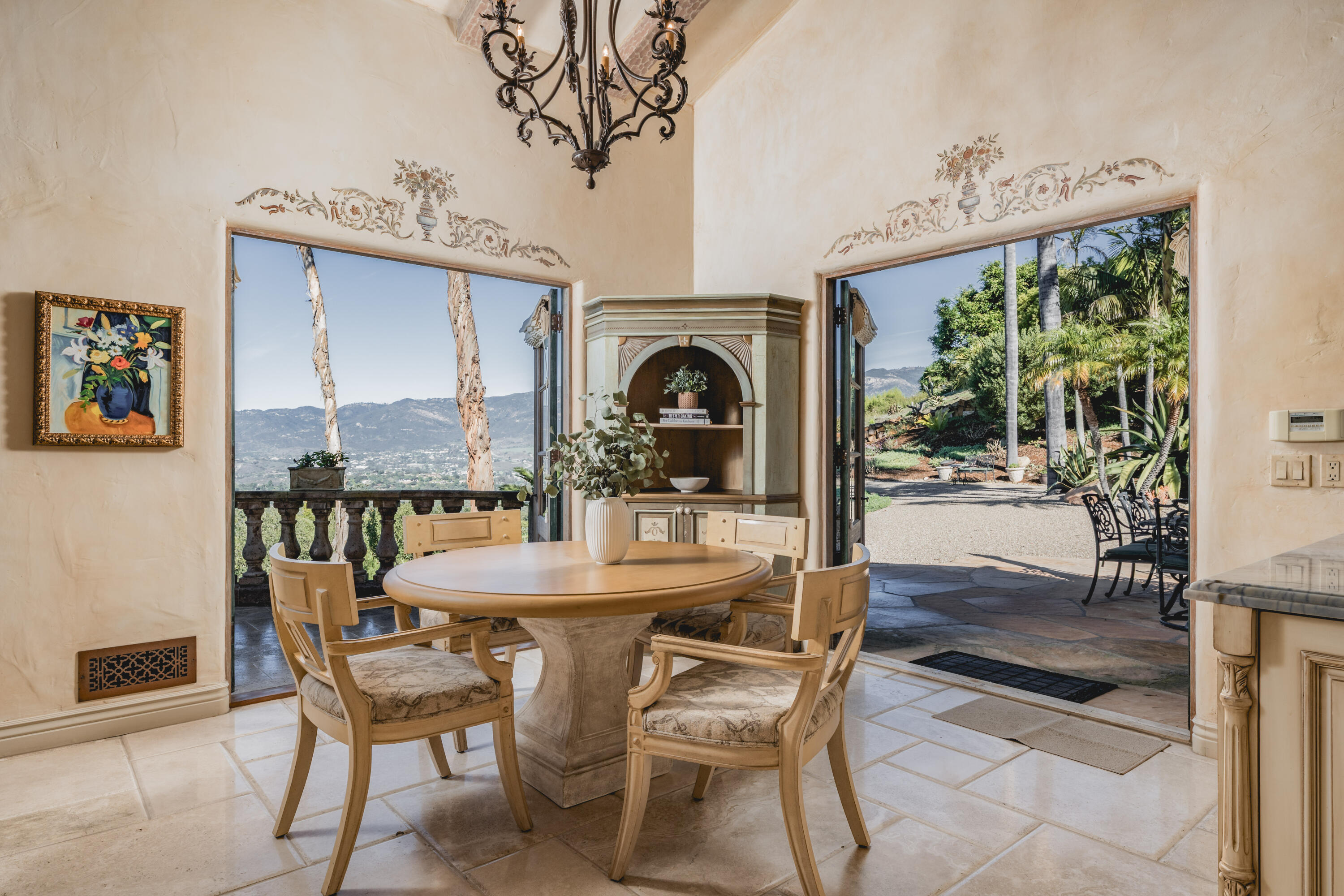 4020 Cuervo Avenue Santa Barbara, CA 93110 - Photo 11 of 48 a view of a dining room with furniture wooden floor and a chandelier
