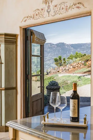a view of a roof deck with wooden floor and fence