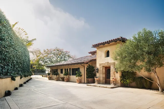 a view of a dining room with furniture wooden floor and a chandelier