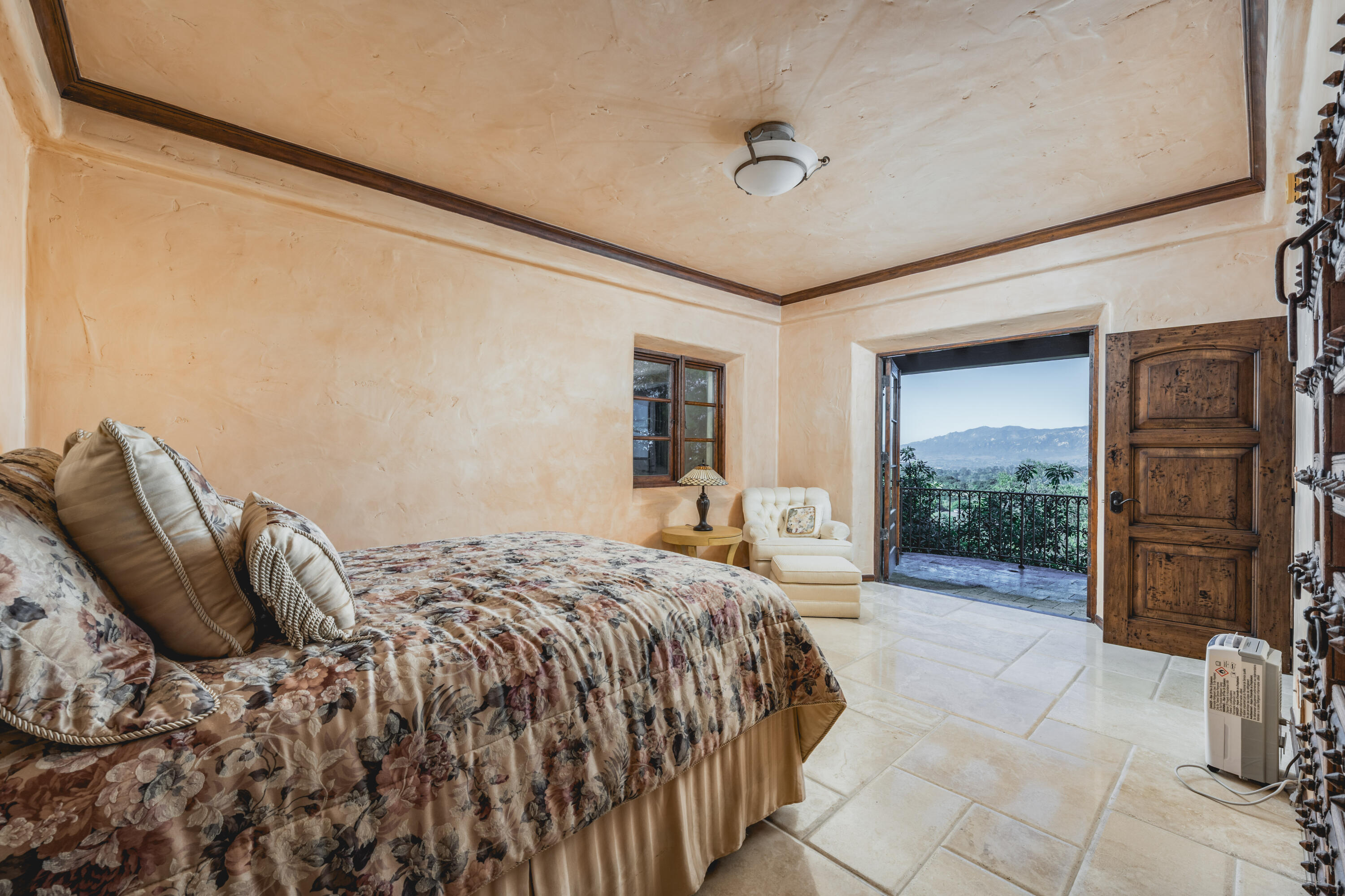 4020 Cuervo Avenue Santa Barbara, CA 93110 - Photo 34 of 48 a large bed sitting in a bedroom next to a window