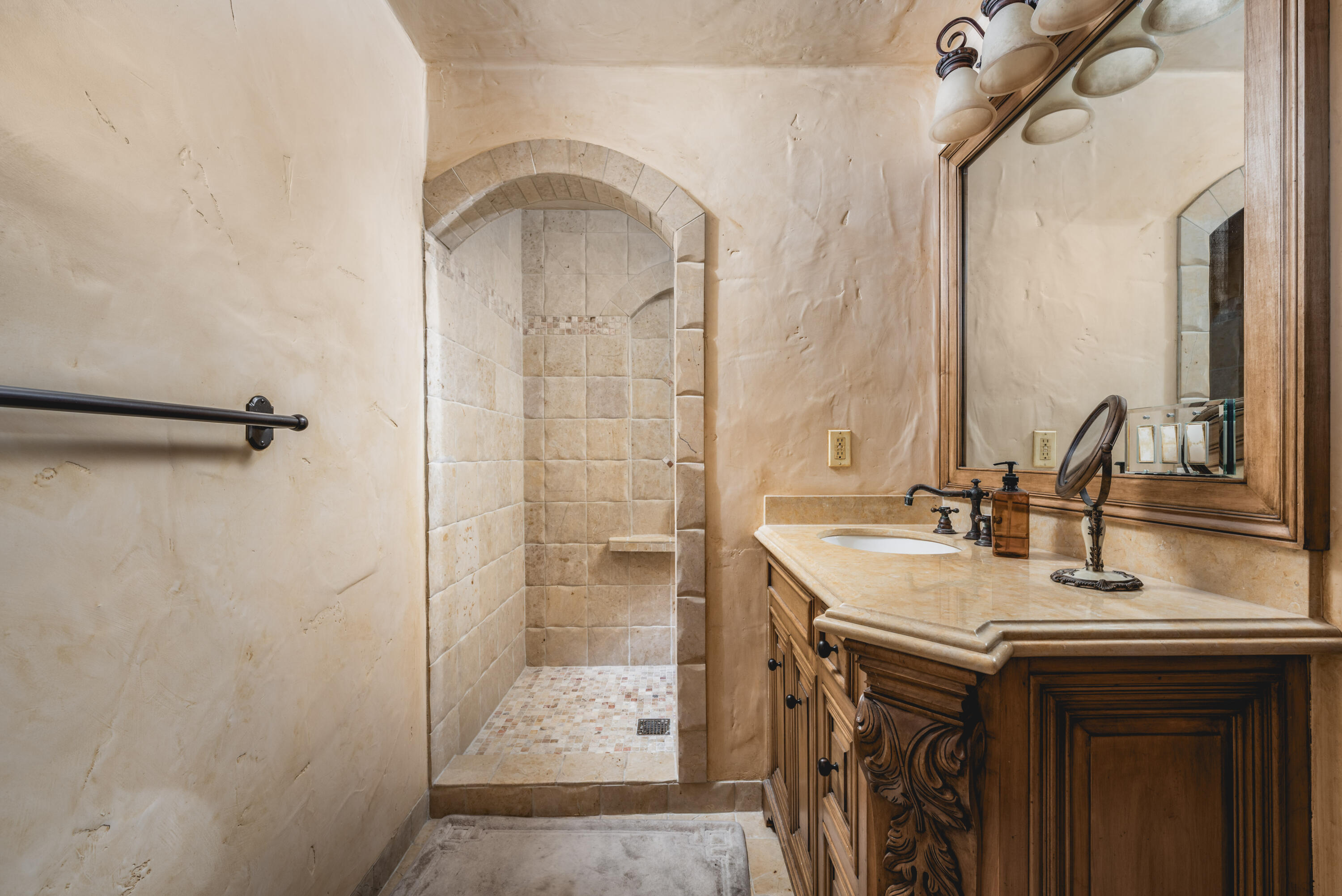 4020 Cuervo Avenue Santa Barbara, CA 93110 - Photo 35 of 48 a bathroom with a sink and a mirror