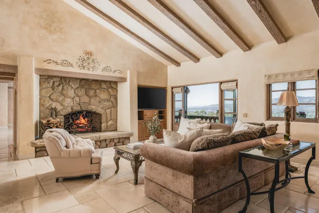 a view of a chairs and table in a window