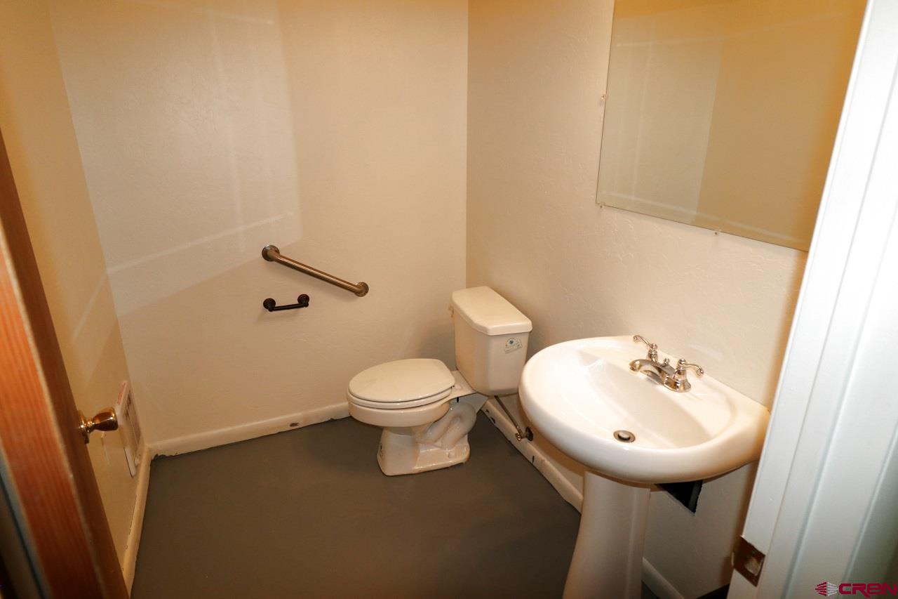 2011 Industrial Road Cortez, CO 81321 - Photo 12 of 16 a bathroom with a sink and a toilet