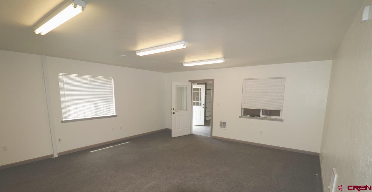 2011 Industrial Road Cortez, CO 81321 - Photo 9 of 16 en empty room with windows and closet