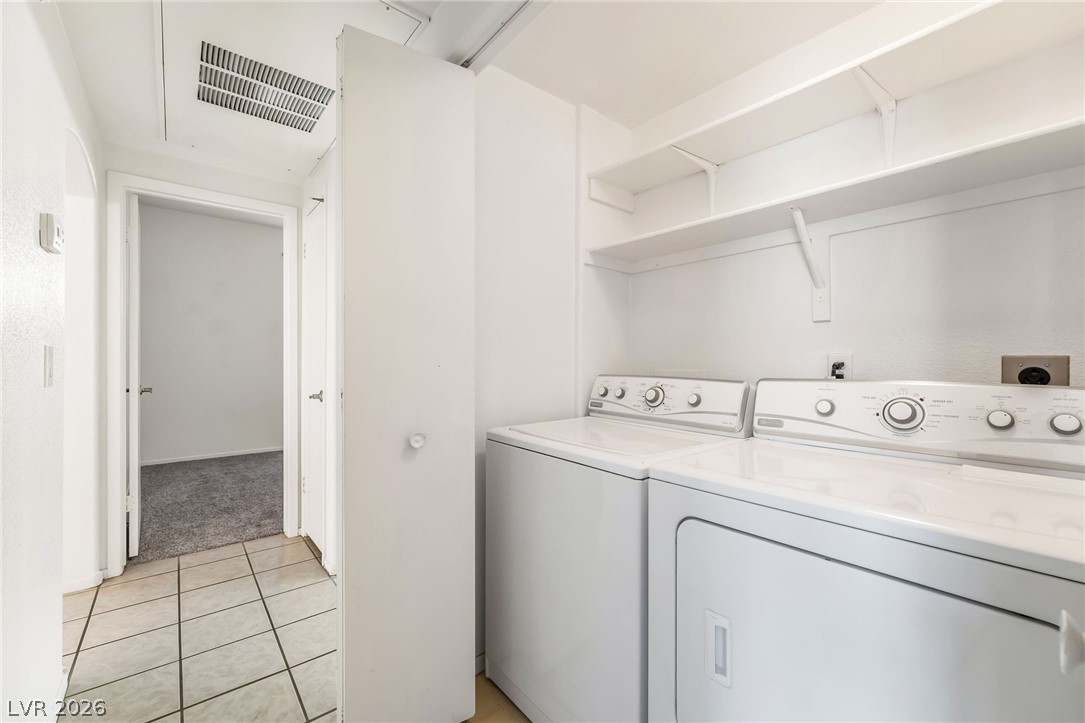 2201 Ramsgate Drive, Unit 811 Henderson, NV 89074 - Photo 28 of 36 Functional laundry space with convenient shelving for organization.