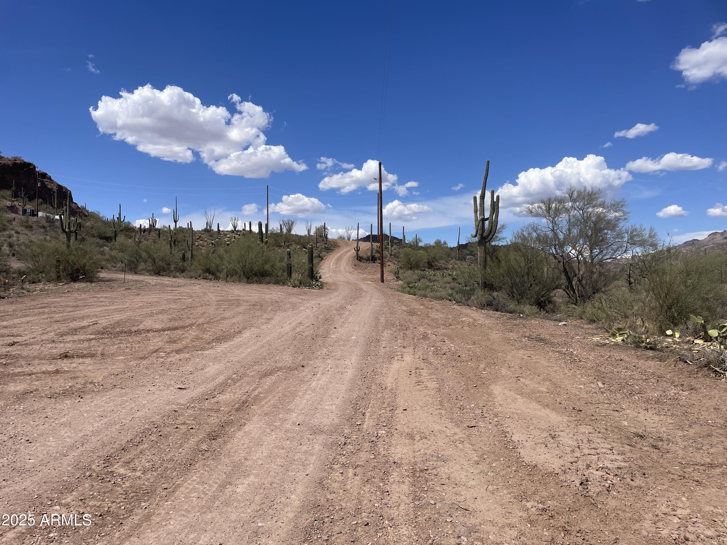 a view of a city street next to a building