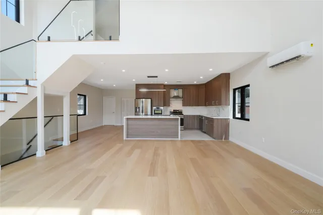 a view of kitchen with furniture and wooden floor