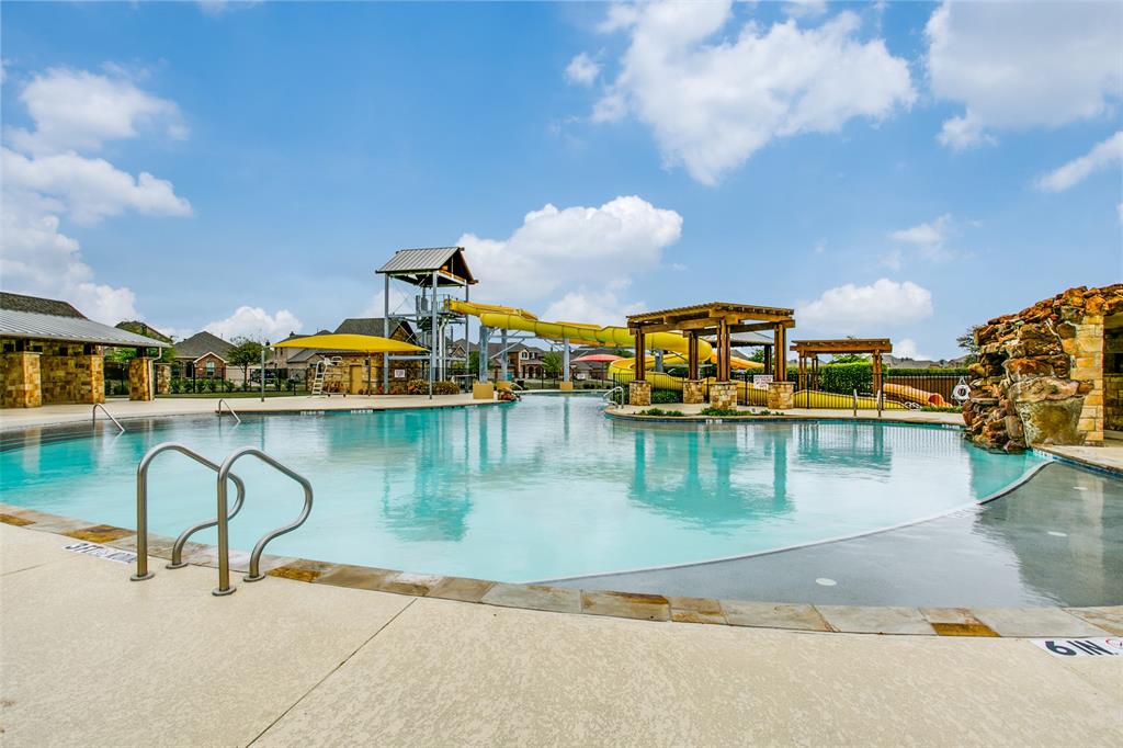10109 Petrified Tree Lane McKinney, TX 75072 - Photo 23 of 27 a view of a lake with a house