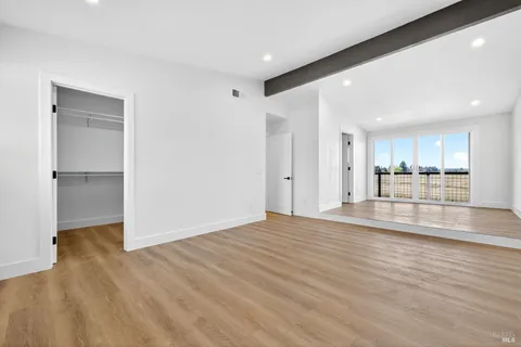a bathroom with a toilet a sink and a large mirror