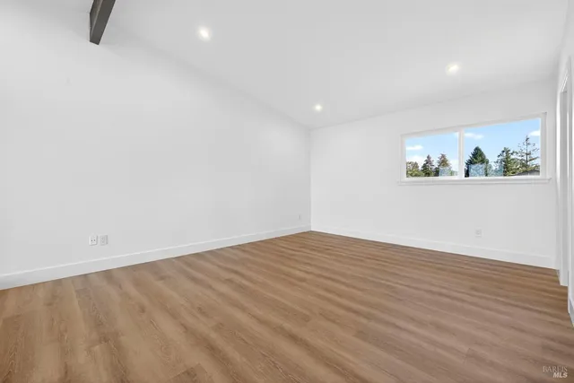 a view of a backyard with plants and patio
