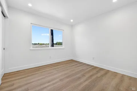 a view of a swimming pool with a garden and seating area