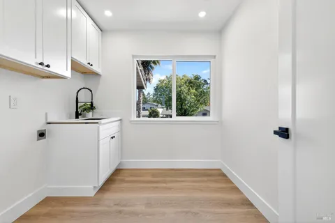 an aerial view of a house with a yard and garden
