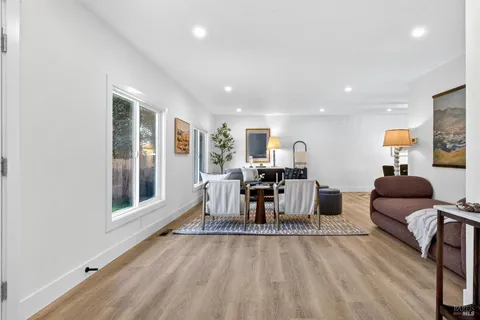 a view of a living room and entryway