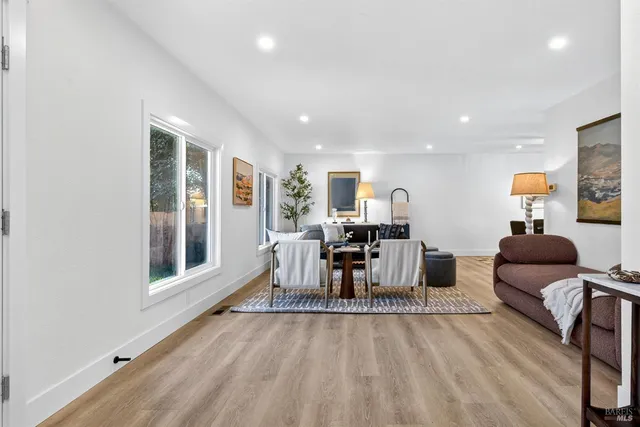 a view of a living room and entryway