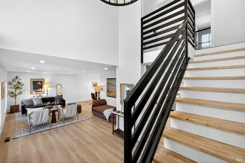 a living room with furniture and a table