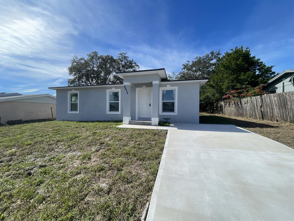 9835 Gray Fox Lane Port Richey, FL 34668 - Photo 4 of 17 front view of a house with a yard