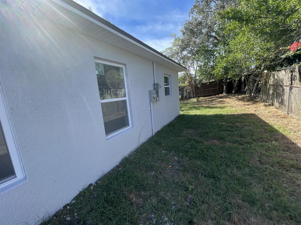 9835 Gray Fox Lane Port Richey, FL 34668 - Photo 6 of 17 a view of backyard of house with green space
