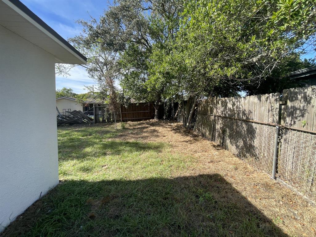 9835 Gray Fox Lane Port Richey, FL 34668 - Photo 7 of 17 a view of a yard with large trees