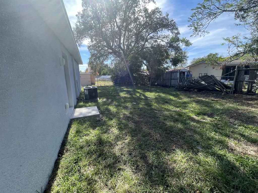 9835 Gray Fox Lane Port Richey, FL 34668 - Photo 8 of 17 a couple of table and chairs in the row yard