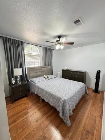 a bedroom with a bed and a mirror