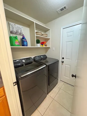 a utility room with washer and dryer