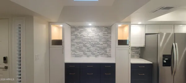 a bathroom with a shower and a sink