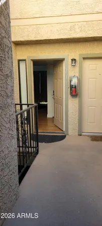 a view of a door and wooden floor
