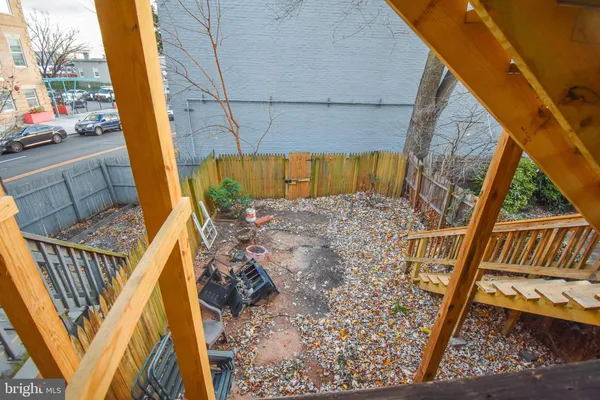 a view of balcony with wooden floor and outdoor seating