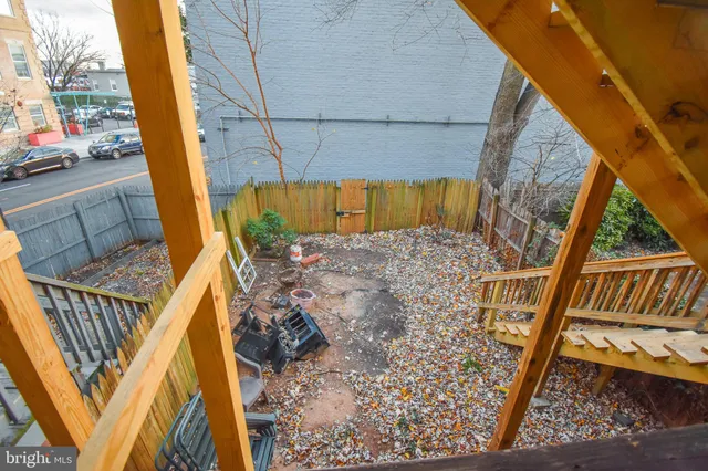 a view of balcony with wooden floor and outdoor seating
