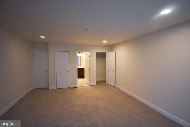 an empty room with closet area