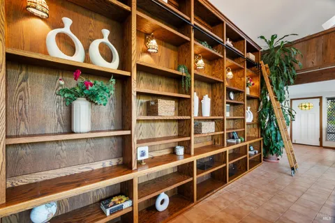 a living room with furniture and a lamp