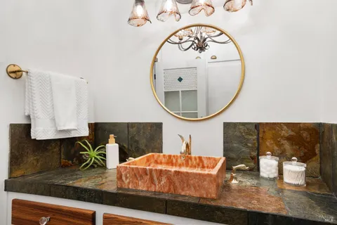 a view of balcony with wooden floor and fence