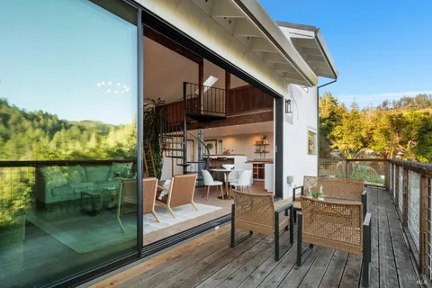 a view of house with backyard and trees