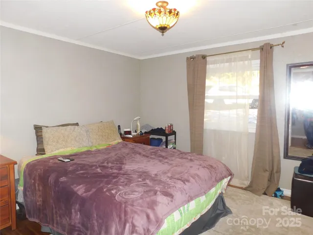 a bedroom with a workspace