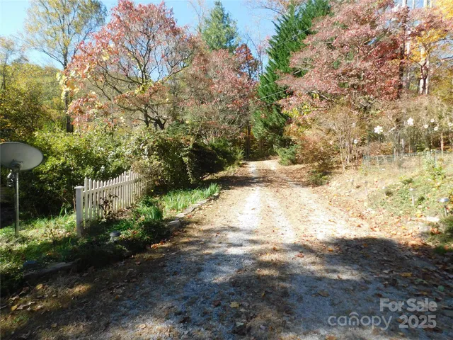 a view of a house with a tree