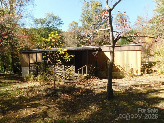 a view of a porch with chairs and wooden floor