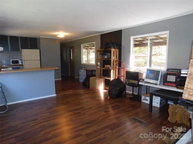 a view of a livingroom with furniture and wooden floor