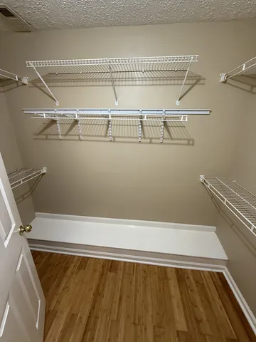 a wooden bench sitting in a kitchen