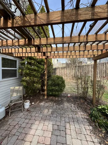 a view of a chairs and table in a patio