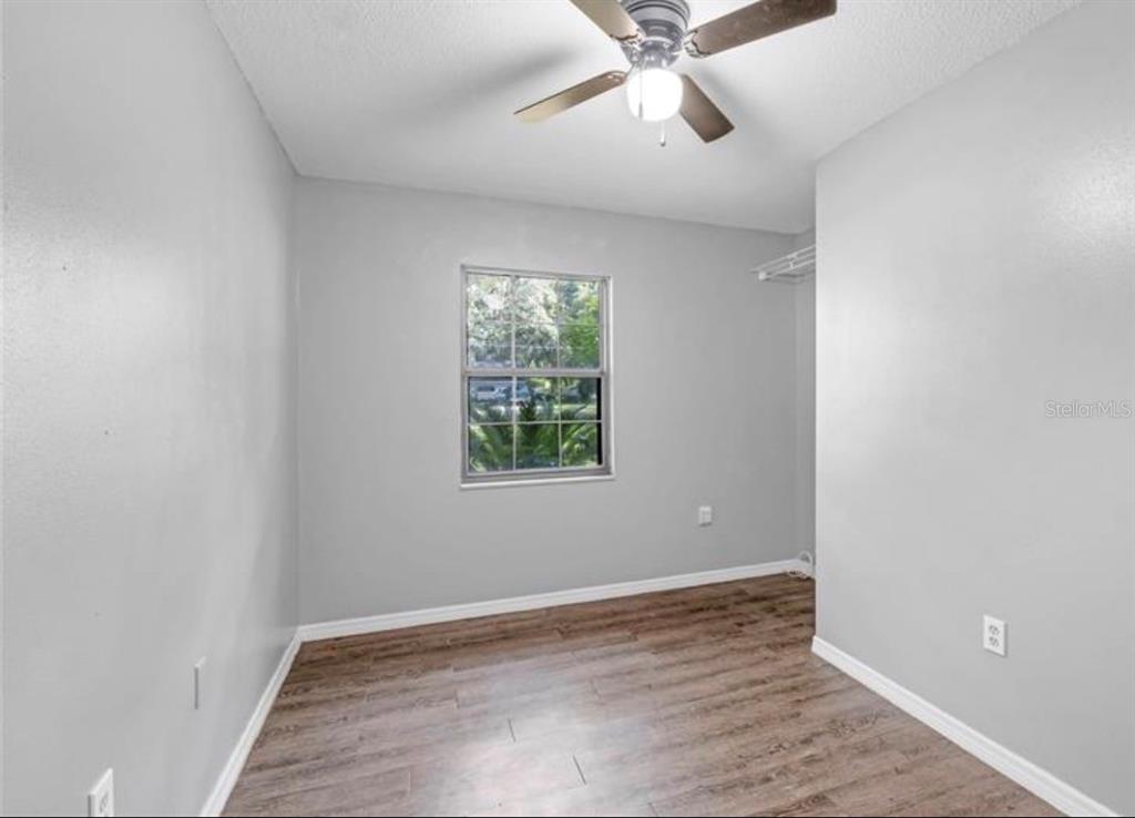 4308 Allen Road Fruitland Park, FL 34731 - Photo 24 of 33 wooden floor in an empty room with a window
