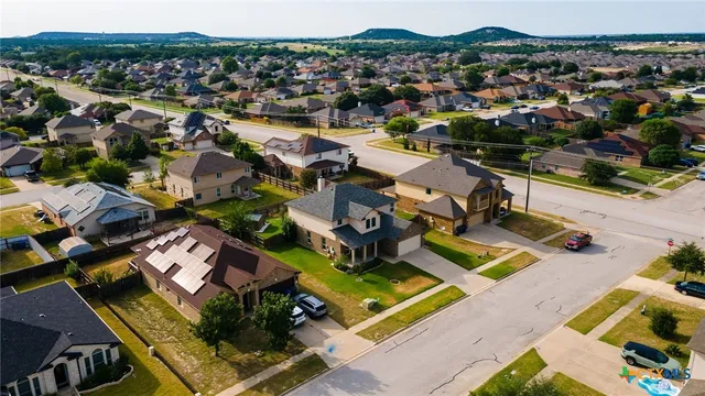an aerial view of a house with a ocean view