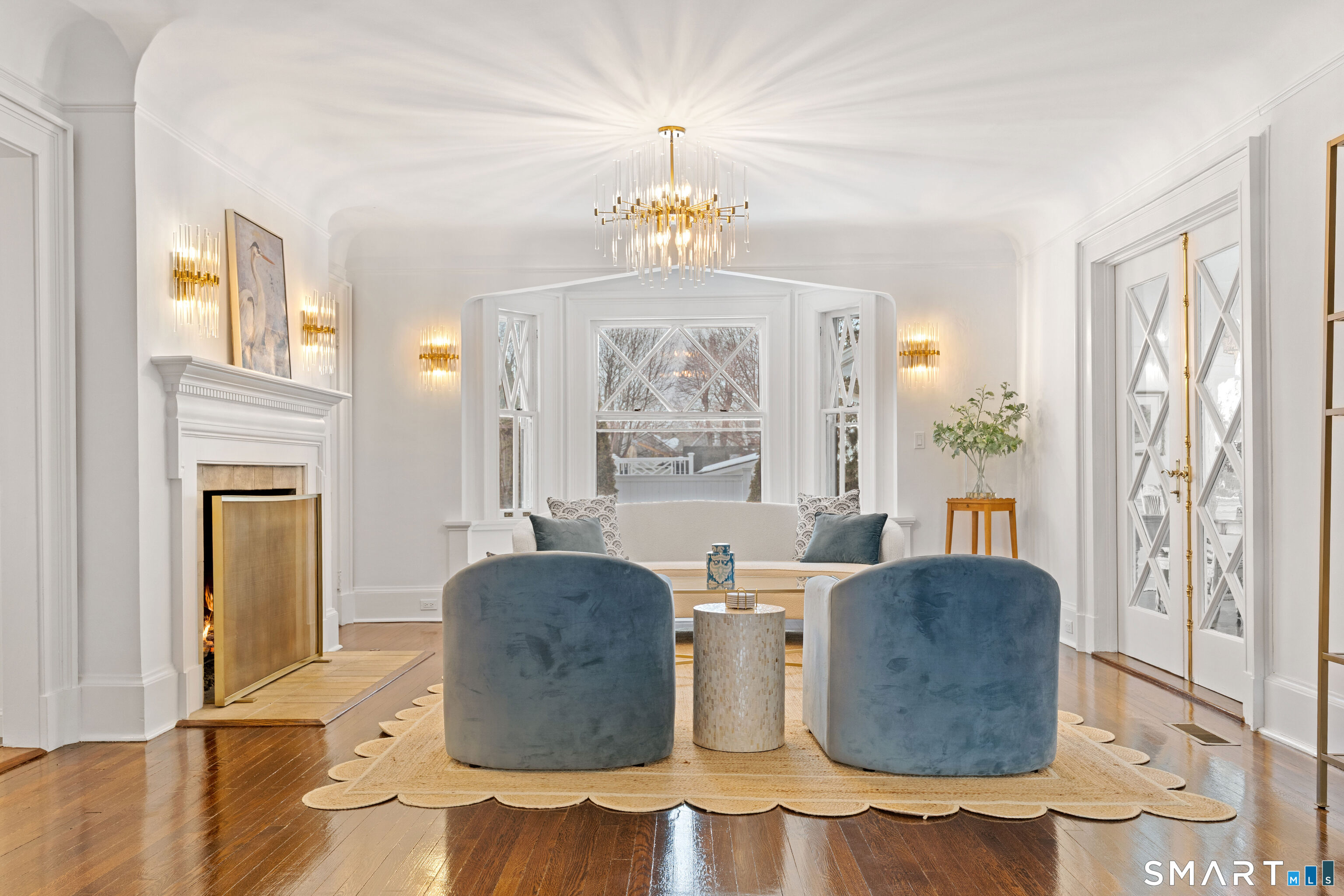 40 Rogers Road Stamford, CT 06902 - Photo 10 of 40 a living room with furniture a chandelier and a window